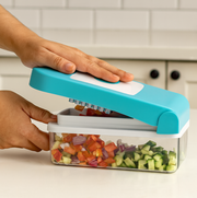 All detachable components of the blue Ganesh 7-in-1 vegetable cutter laid out.