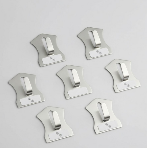 An 18-piece set of self-adhesive stainless steel wall hooks displayed on a white surface.