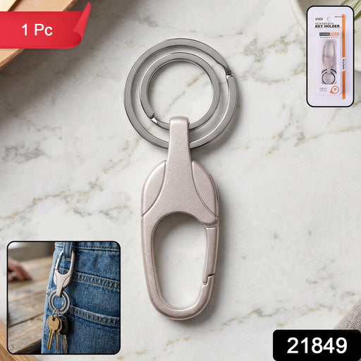 Close-up of the spring-loaded metal carabiner clip on a keychain