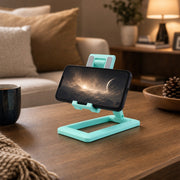 Foldable phone stand in office setting with laptop