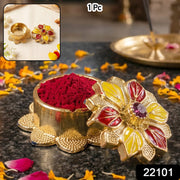 Traditional golden sindoor holder for puja
