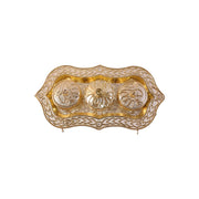Studio shot of the golden Kankavati on a white background.