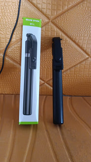Folded selfie stick with phone holder and Bluetooth remote for travel