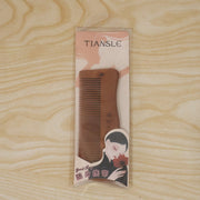 Beautiful wooden comb in packaging, ideal gift for hair care enthusiasts
