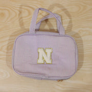 Detailed view of multi-pocket toiletry pouch with compartments