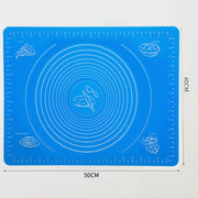 Durable silicone mat being folded to demonstrate its flexibility and ease of storage.