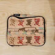 Person holding a compact travel organizer bag, ready for daily use.