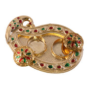 Golden Kankavati holder in use during a pooja ceremony