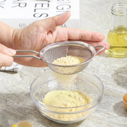Tea strainer in use for kitchen straining