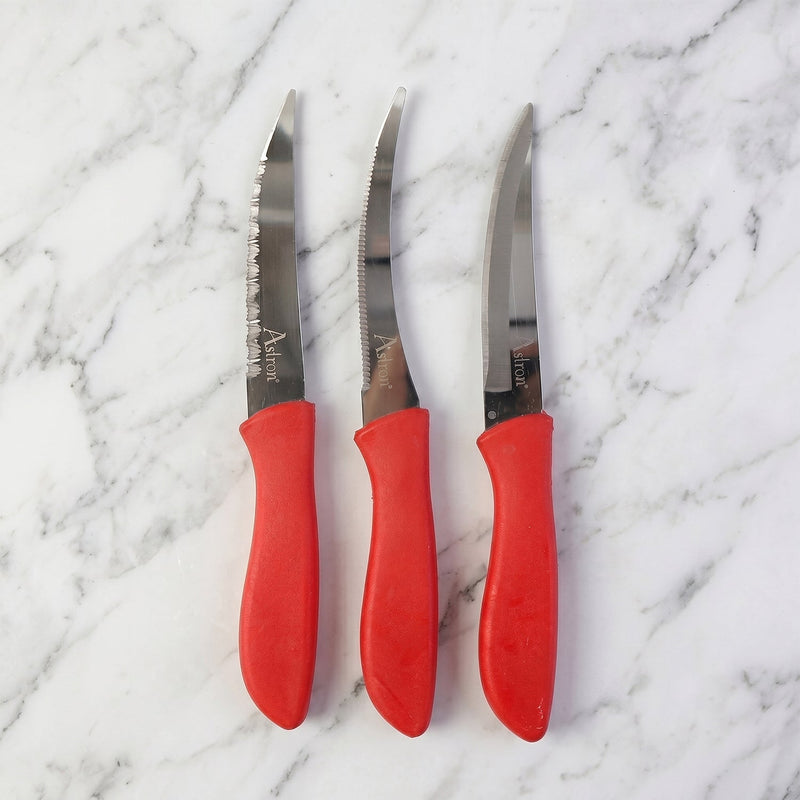 Kitchen knife slicing a tomato
