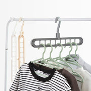 Front view of the Organivo 9-hole plastic hanger, showcasing its multi-slot design.