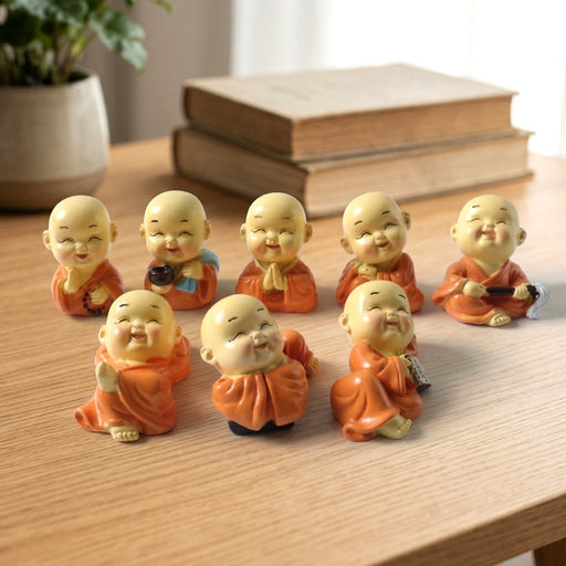 Mini Monk Buddha Idol Set with joyful expressions, 8-piece decorative figurines