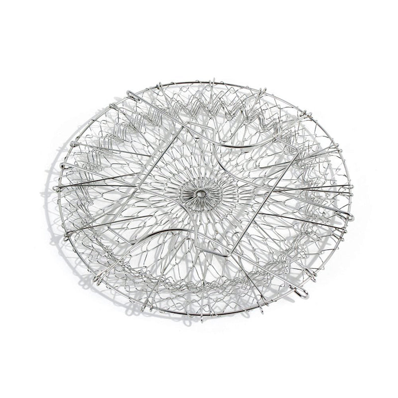 The durable stainless steel chef basket straining boiled vegetables for a healthy meal.