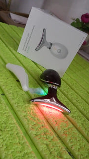 Woman applying the Neck Face Massager to her jawline for a lifting effect.