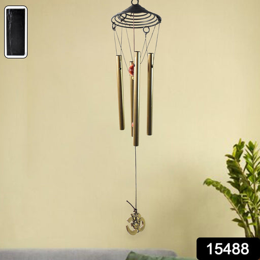 Close-up of dragonfly design on outdoor wind chime showing fine details