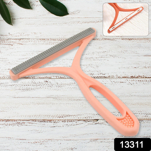 Compact double-sided lint brush, ideal for travel and quick clean-ups.