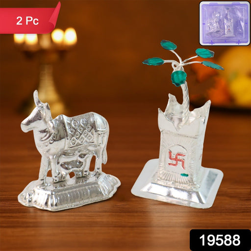 Close-up of sacred Kamdhenu cow silver-plated idol with calf for spiritual worship