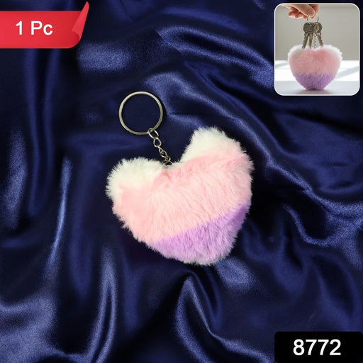 Heart shaped plush keychain attached securely to bag zipper