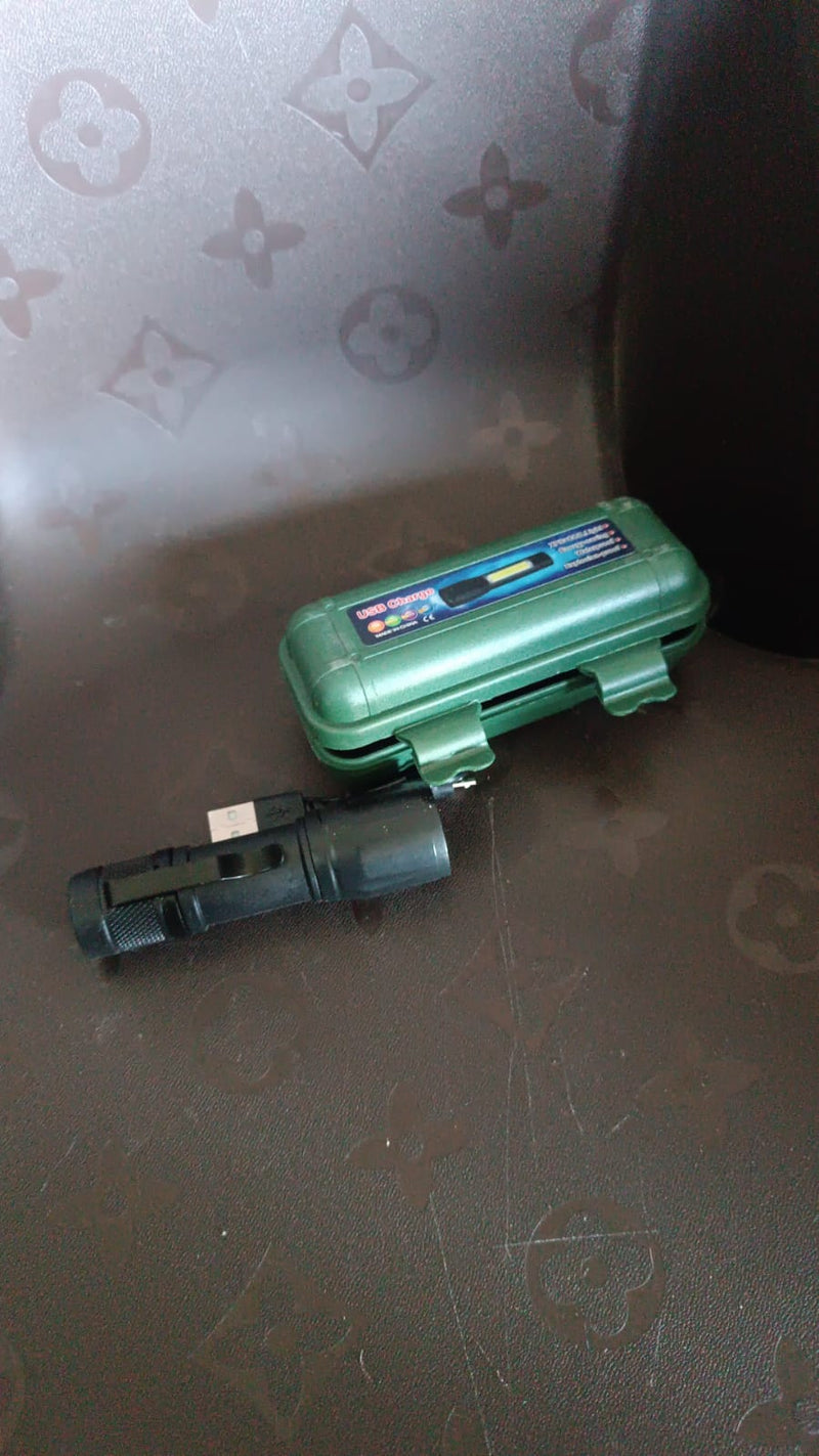Side view of the versatile rechargeable mini flashlight with metallic finish.