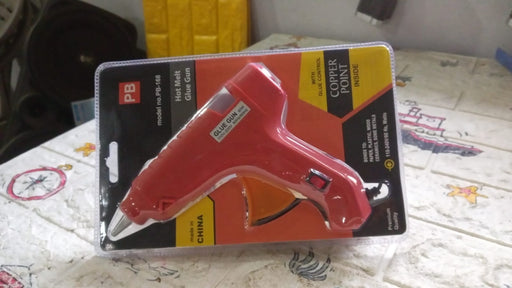 Packaging for the professional hot melt glue gun, indicating its power and contents.