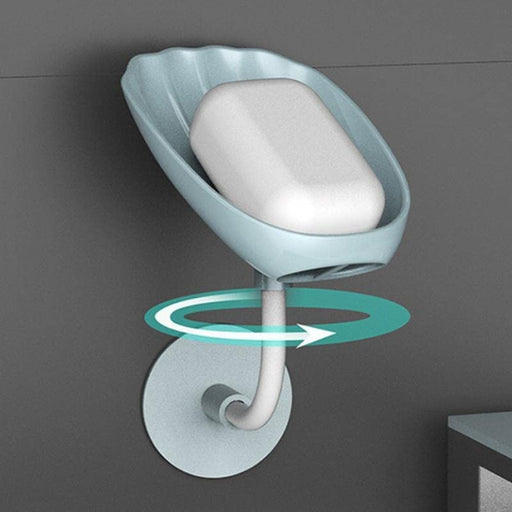 Grey self-draining soap dish with a bar of soap, showcasing its sleek design.