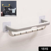 Double bar towel rack neatly holding bath towels and a hand towel.