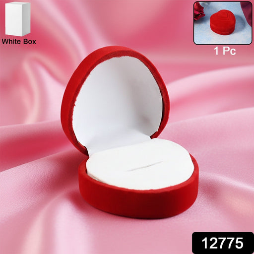 Open velvet ring box showing smooth white cushioned interior holding ring securely