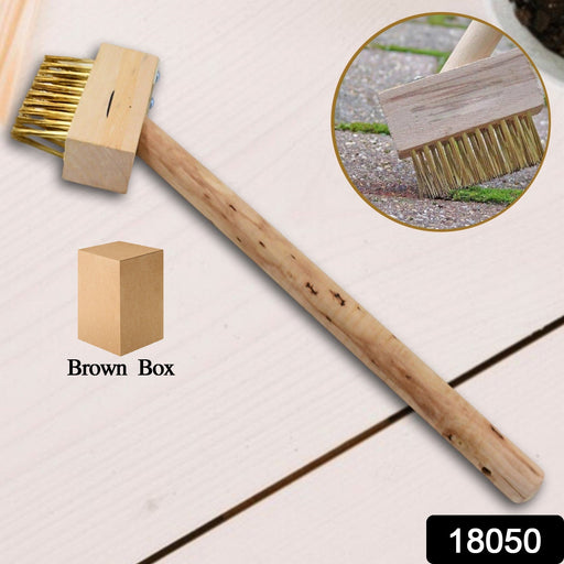 Close-up of the sturdy wire bristles on the wooden block paving brush.