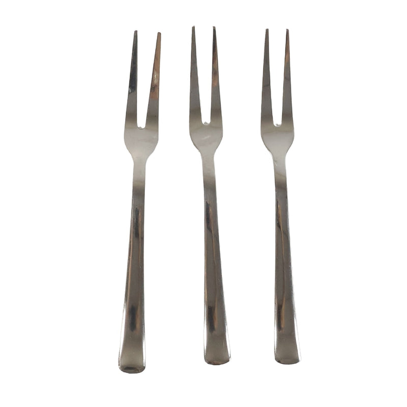 Three small appetizer forks laid out for serving snacks