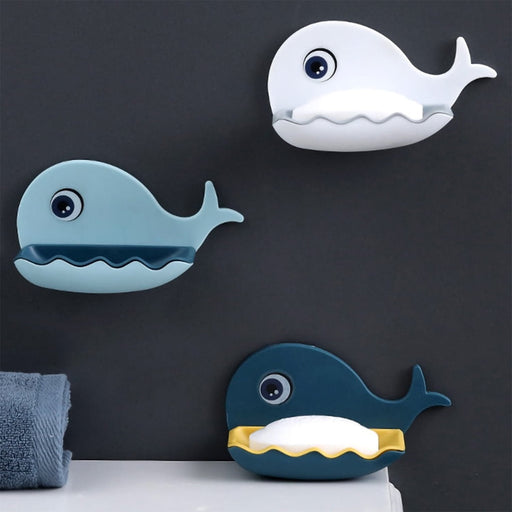 Close-up of the fish shape soap dish, showcasing its adhesive backing and efficient drainage slots.