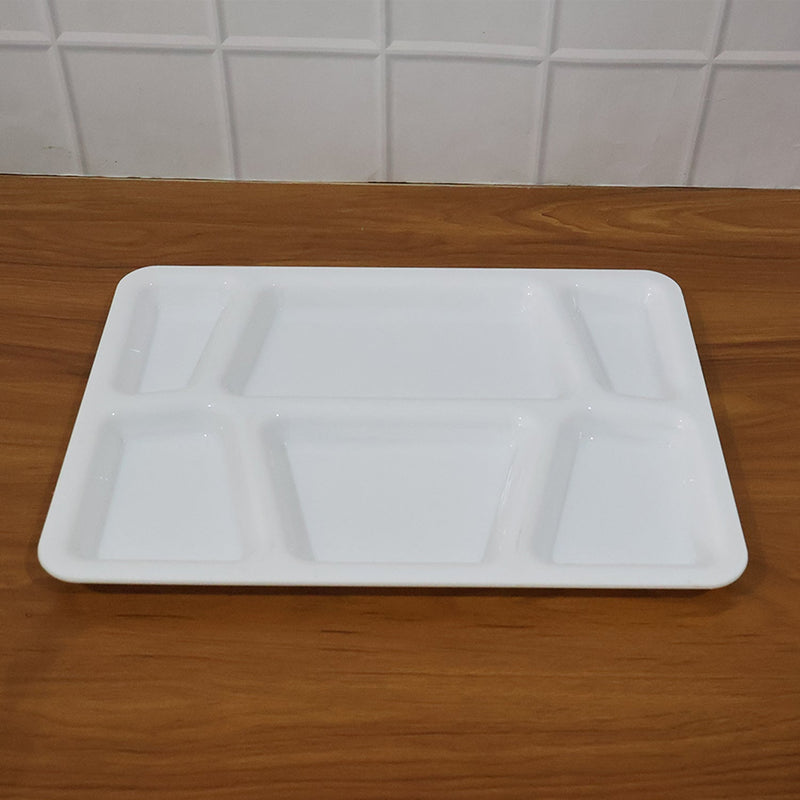 Rectangular sectioned plastic tray with spill-proof raised edges for tidy meal presentation.