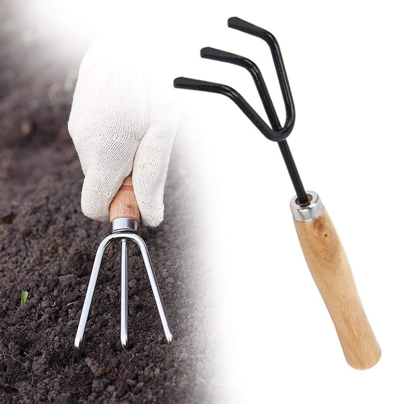 Detailed view of the sharp steel tines on the hand cultivator for effective weeding.