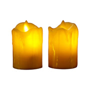 A group of glowing flameless candles providing ambient light in a home setting.