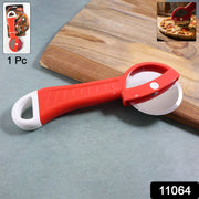 Close-up of pizza slicer wheel cutting smooth pizza slices