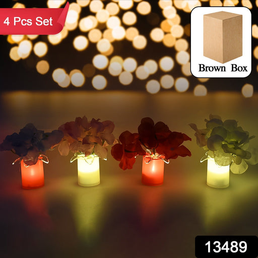 Close-up of a wireless LED decorative light, designed as a vase with silk flowers.