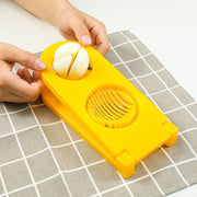 Quickslice 2-in-1 egg slicer creating perfect slices and wedges from a boiled egg.
