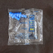 Swimmer wearing soft silicone ear plugs in clear water for ear protection