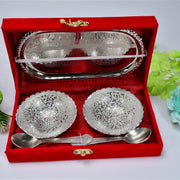 The two silver plated bowls and spoons neatly placed inside the rich red velvet gift box, ready for gifting.