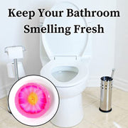 Compact floral-scented air freshener block, ideal for small toilet spaces.