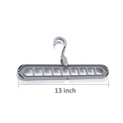 Close-up view of the nine precisely designed holes on the plastic hanger for secure garment storage.