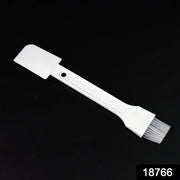 Small dust cleaning brush effectively cleaning keyboard keys.