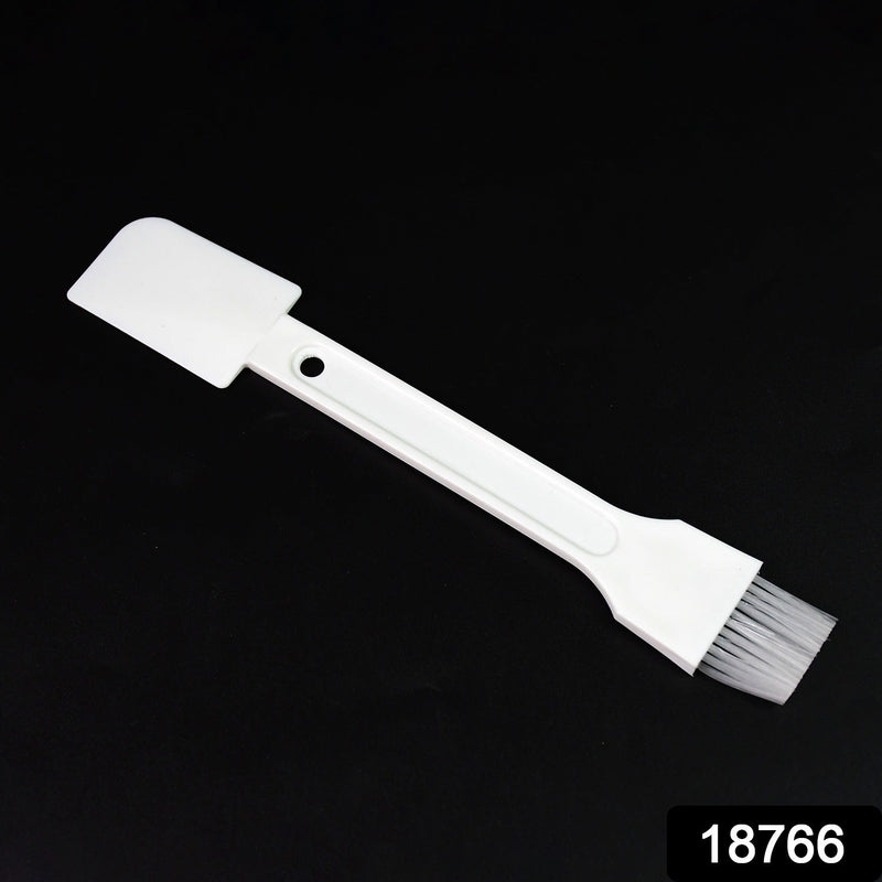 Small dust cleaning brush effectively cleaning keyboard keys.