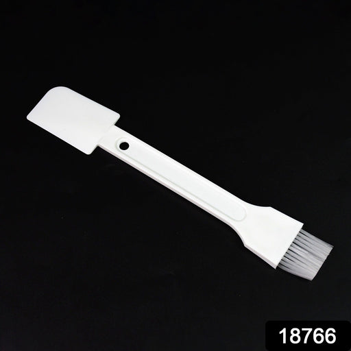 Small dust cleaning brush effectively cleaning keyboard keys.