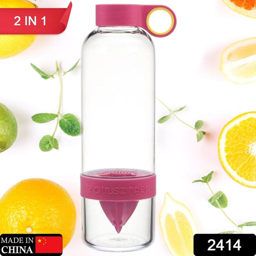 Side angle of the juice infuser bottle, showing a lemon half securely placed in the built-in juicer.