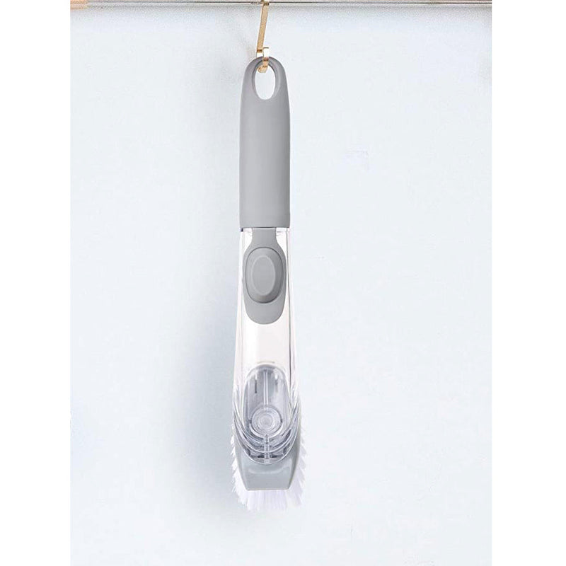 Close-up of the liquid dispensing dish cleaning brush bristles and scraper.
