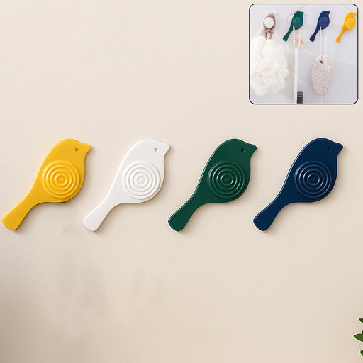 A set of four elegant self-adhesive bird hooks displayed against a clean wall.