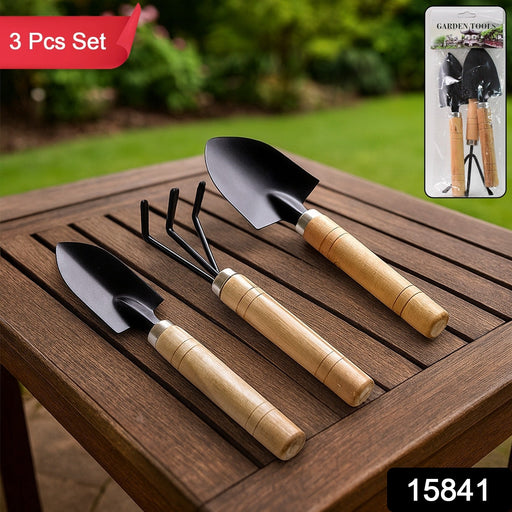 Close-up of polished wooden handle on garden tool set