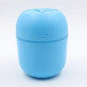 Top-down view of the USB Air Humidifier, showing the water tank and control button.
