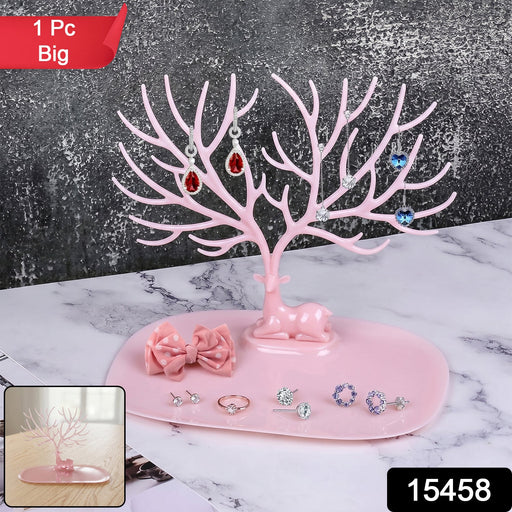 Side view of large pink deer jewelry stand with tree-shaped branches, India