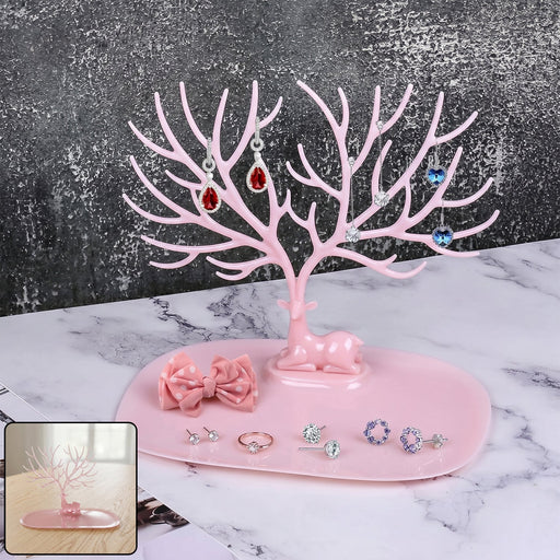 Pink deer-shaped jewelry stand with tree branches for earrings and rings, India